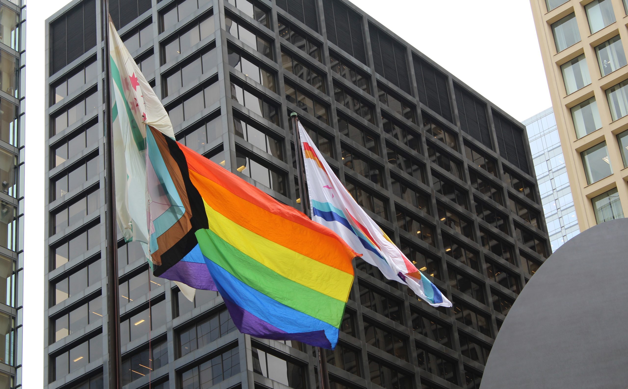 Elected officials raise Pride flag over Daley Plaza, warn of threats to LGBTQ+ rights 